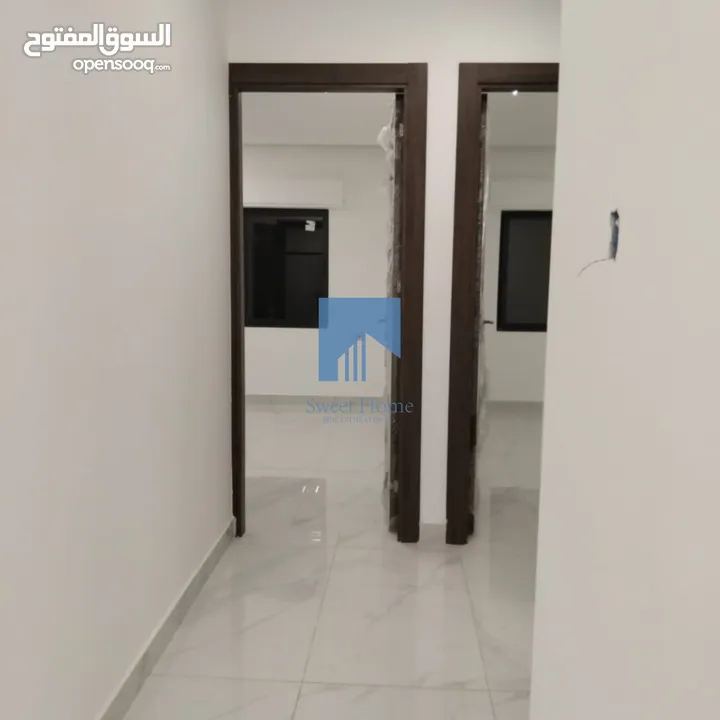 شقة أرضية فاخرة للبيع في تلاع العلي  - قرب دوار الواحة 95م مع ترس امامي تشطيب سوبر ديلوكس لم تسكن
