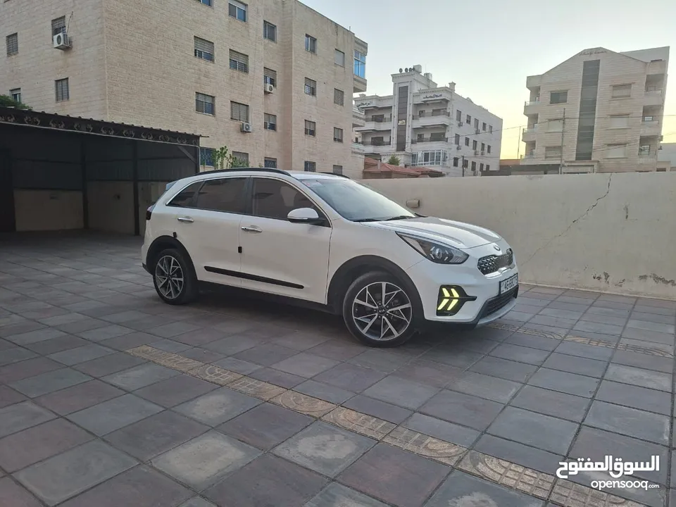 كيا نيرو 2021 جمرك جديد وارد كوري ممشي 32  الف فحص كامل جنطات تورنج