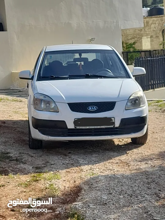 كيا برايد لون ابيض 2008