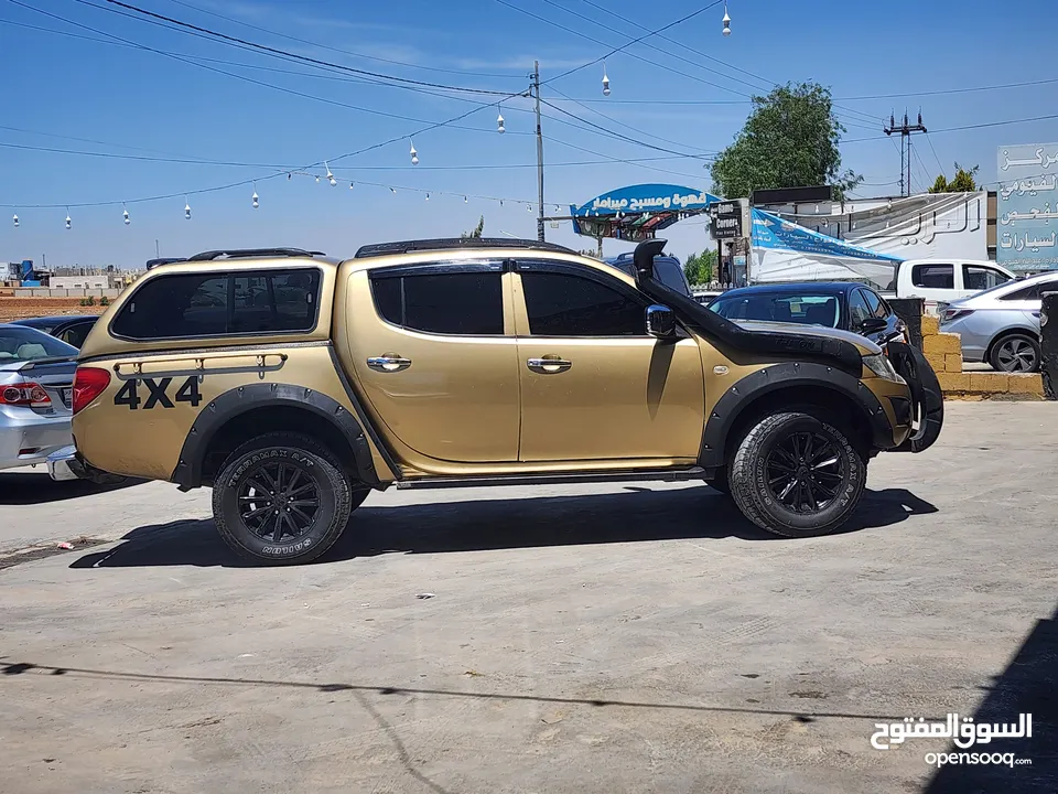 بكم ميتسوبيشي L200 2013 4×4 معدل بحالة ممتازة.