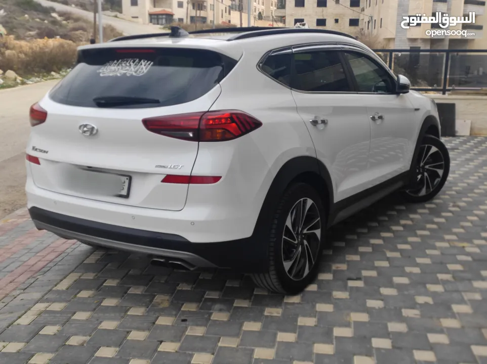 هونداي توسان فل الفل اضافات دهان شركة وعداد أصلي 70000كم فقططط رخصة وتأمين شامل للبيع بسعر مغري