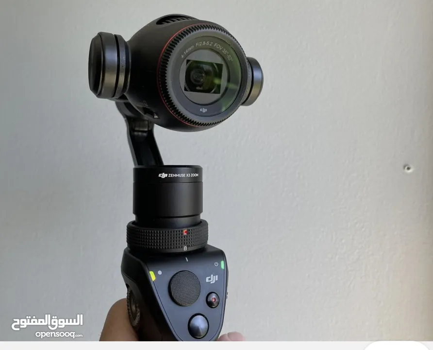 Osmo + Zenmuse X3 Zoom بكاميرا ثلاثية المحاور وكاميرا 4K ، وهو مصمم ليتم تثبيته على مقبض D