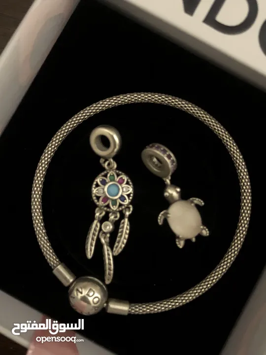 PANDORA bracelet, for sale, plus two charms as a gift. price for all 60 dinars