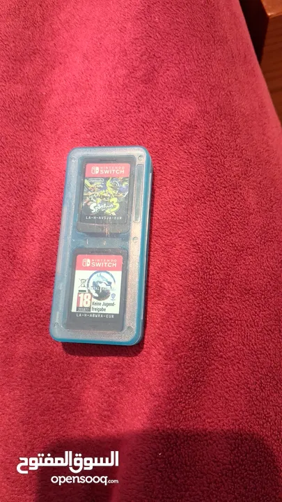 نينتيندو سويتش اوليد مع العاب و العاب بلايستيشن 4 و 5