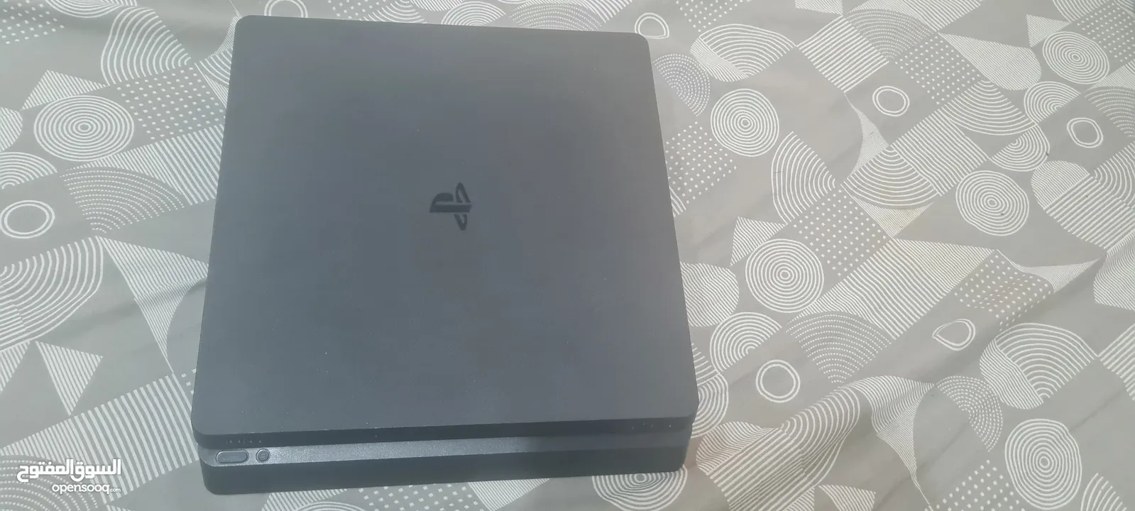 playstation 4 slim 500gb with 2 controllers and 7 games