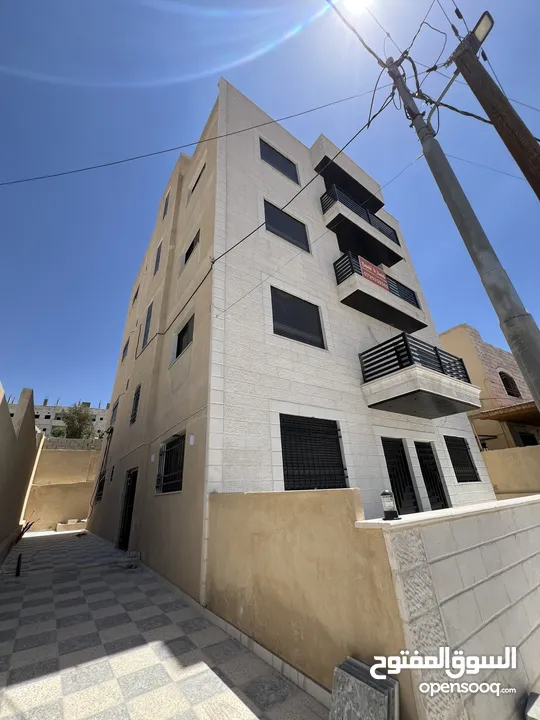 عمارة للبيع أربع شقق طابقية مساحة الشقة 148 متر في ماركا الشمالية قرية خالد بن الوليد
