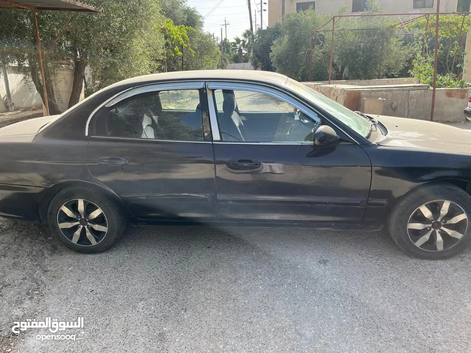 كيا اوبتيما 2002