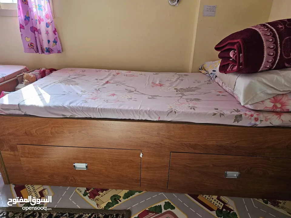 2 Wooden Single Beds with Spacious Drawers and Neat Mattresses