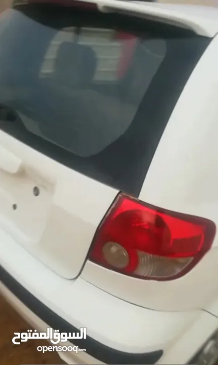 هيونداي كلك لونها ابيض 2003
