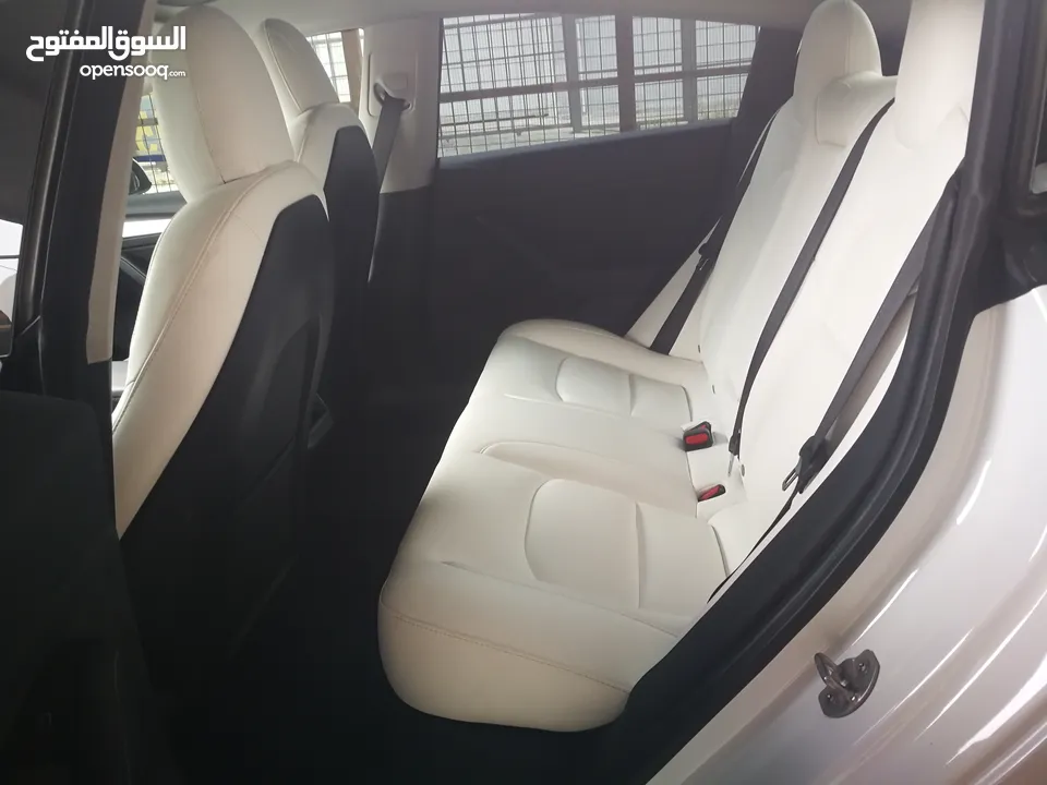 تيسلا 2021 ستاندرد بلس فحص كامل 4 جيد في المنطقة الحرة وارد امريكي داخلي ابيض