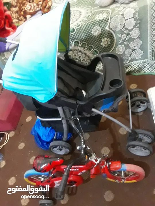 عربانه اطفال مع دراجه