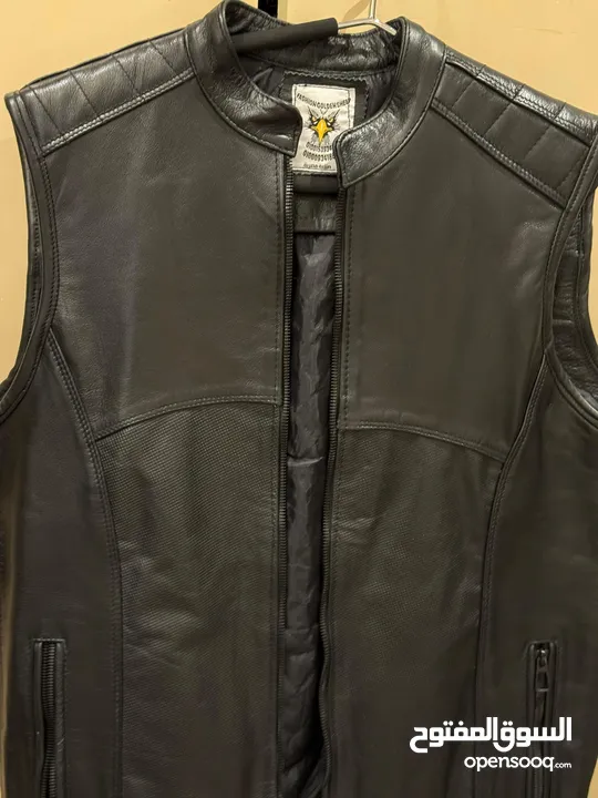 Original leather Biker’s vest and various helmets