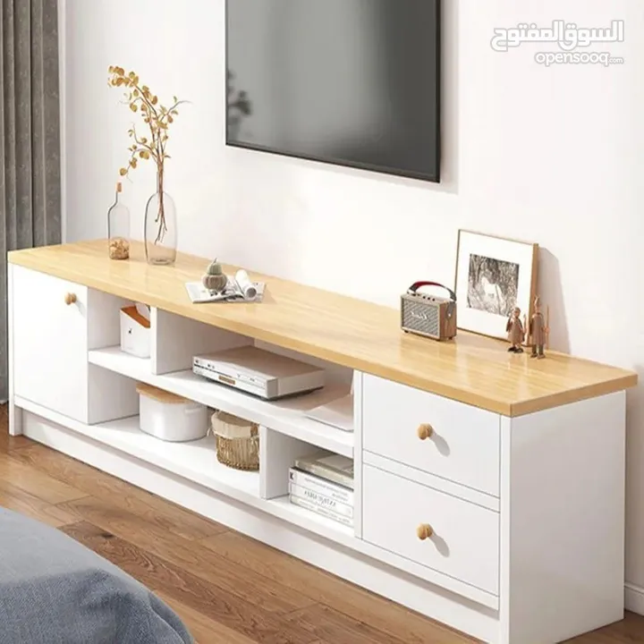 طاولة تلفزيون بلون أبيض وخشبي بتخطف الأنظار! المقاس 160*30*40 سم تصميم مودرن وعصري