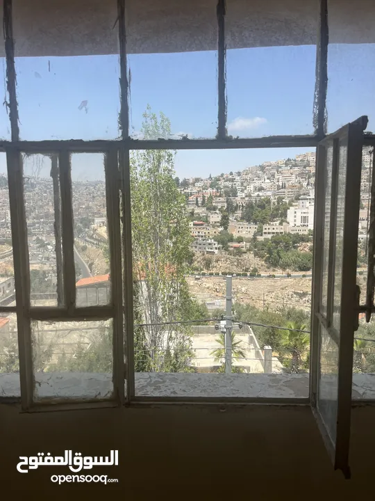 قطعة أرض مع منزل طابقين للبيع في مدينة السلط-نقب الدبور