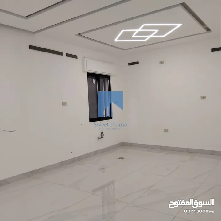شقة أرضية فاخرة للبيع في تلاع العلي  - قرب دوار الواحة 95م مع ترس امامي تشطيب سوبر ديلوكس لم تسكن