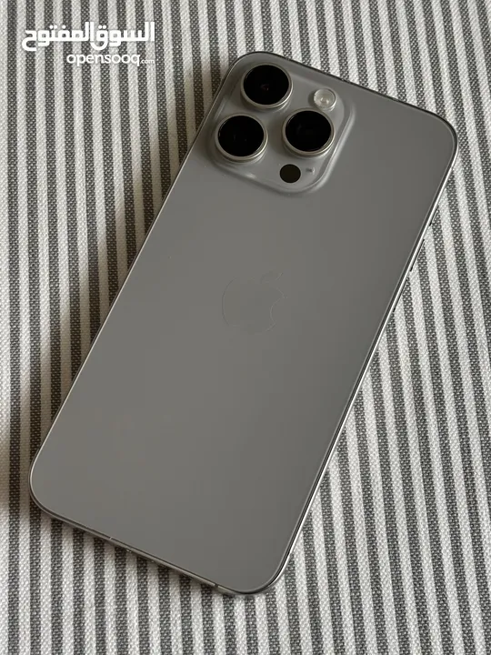 iPhone 15 bro Max natural titanium 256 GB used like a new