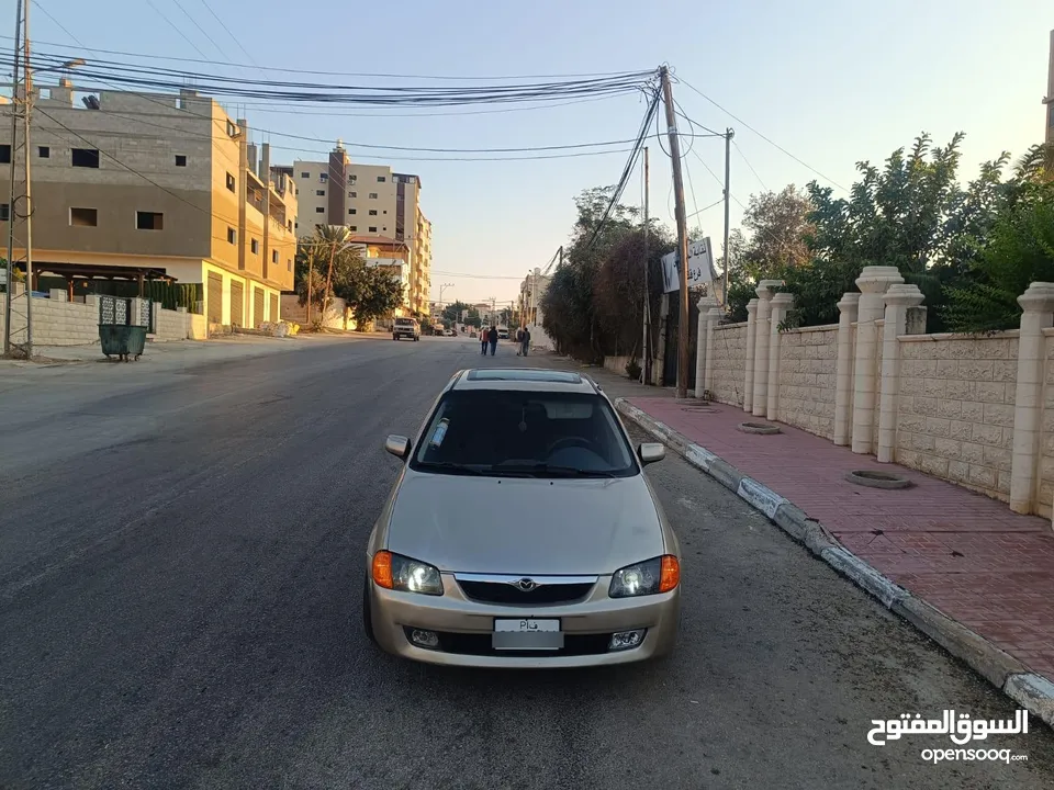 مازدا 323 اتماتك فتحه اصليه تحفه بمعنا الكلمه بسعر حرق 29500 ألف نقدا بدل وارد فحص نخب