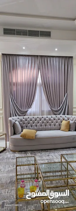Quality House curtains and sofa
