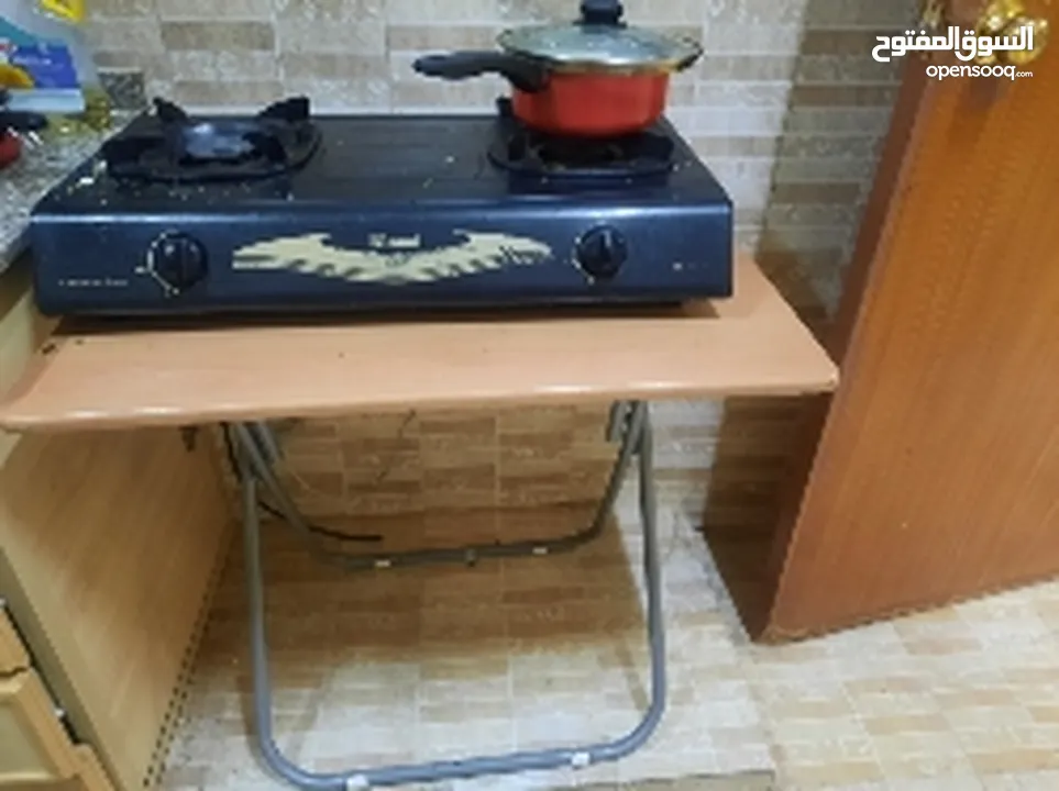 Gas stove along with table