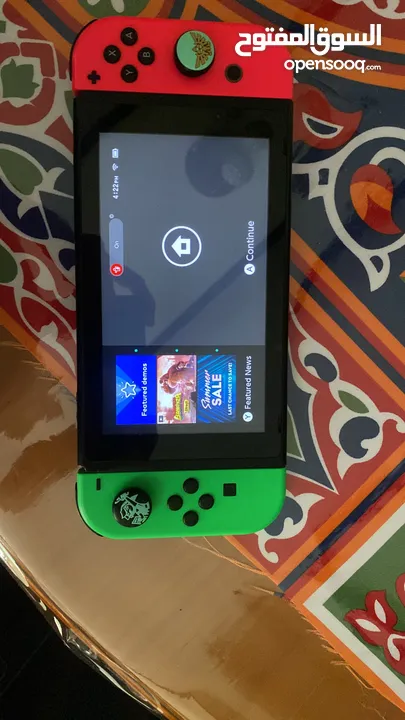 نينتيندو سويتش + 2 joy con إضافيتان مع شمعة مع مسكتين مع اغراضه ( بدون ألعاب )و شنتة