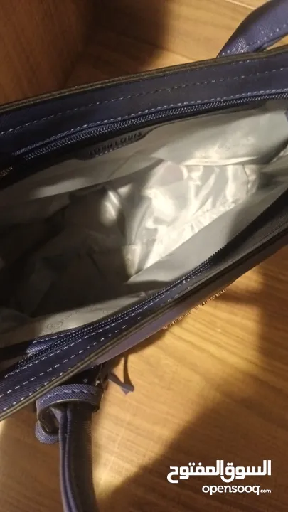 حقيبة يد نسائية جديدة ( لم تستخدم ابداً )  قيمتها الاصلية