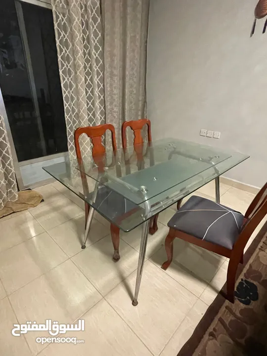 Glass top dining table with 3 chairs along with study table