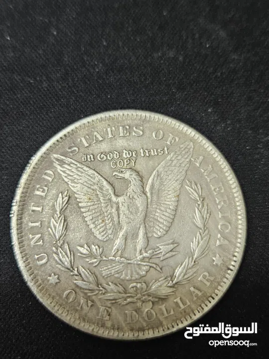 هذه العملة هي دولار مورغان (Morgan Dollar) أمريكي