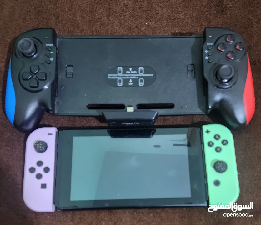 نينتندو سويتش مع كينترولارنينتندو سويتش مع كينترولارنينتندو سويتش مع كينترولار