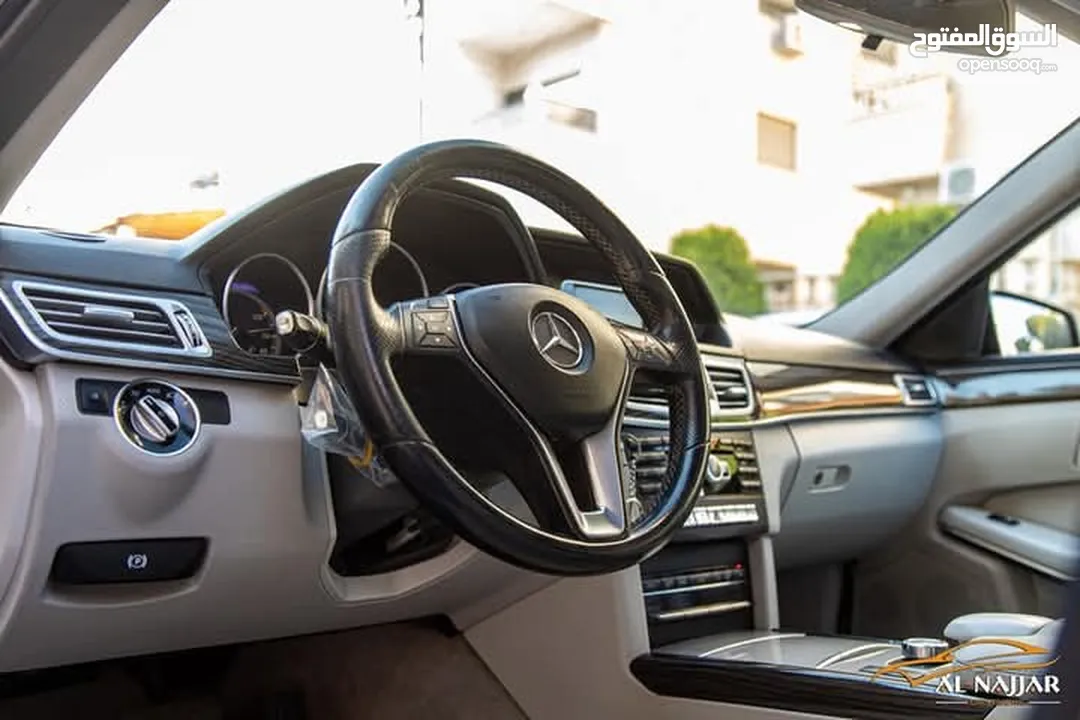Mercedes E200 Avantgarde Amg kit 2015  السيارة وارد و بحالة الوكالة