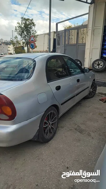 سيارة دايو لانوس اوتوماتيك موضيل 2002 متور 1.6 مرخصة مأمنة ، السيارة لعبة