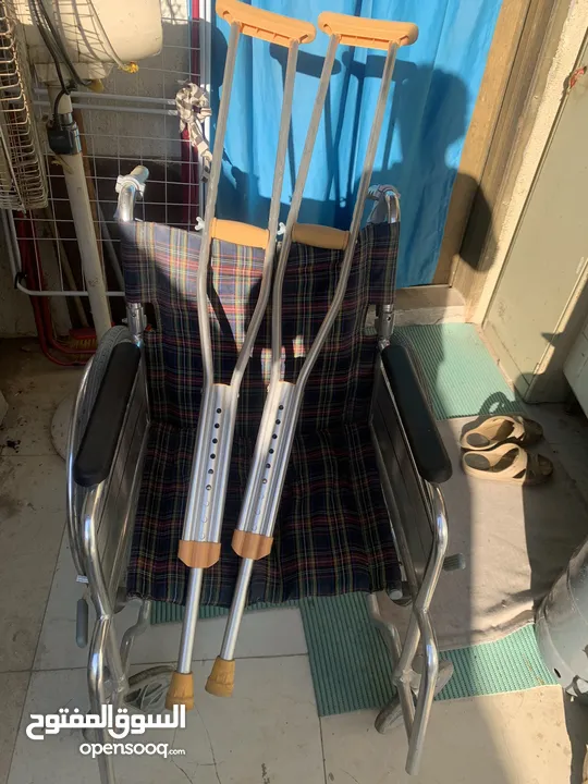 Wheel chair and two sticks for sale note wheel chair