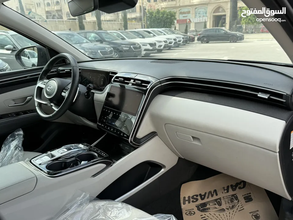 هونداي توسان ترخيص 2022 محرك 1600 هايبرد plug in/يقطع على الشحنه 65 كيلو متر