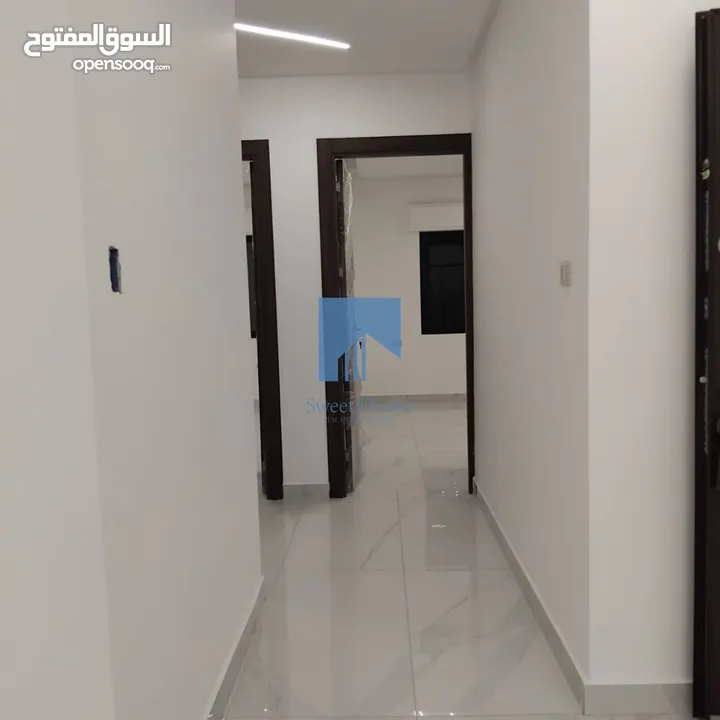 شقة أرضية فاخرة للبيع في تلاع العلي  - قرب دوار الواحة 95م مع ترس امامي تشطيب سوبر ديلوكس لم تسكن