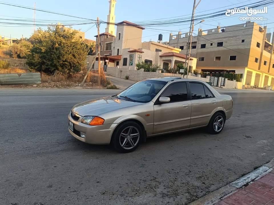 مازدا 323 اتماتك فتحه اصليه تحفه بمعنا الكلمه بسعر حرق 29500 ألف نقدا بدل وارد فحص نخب
