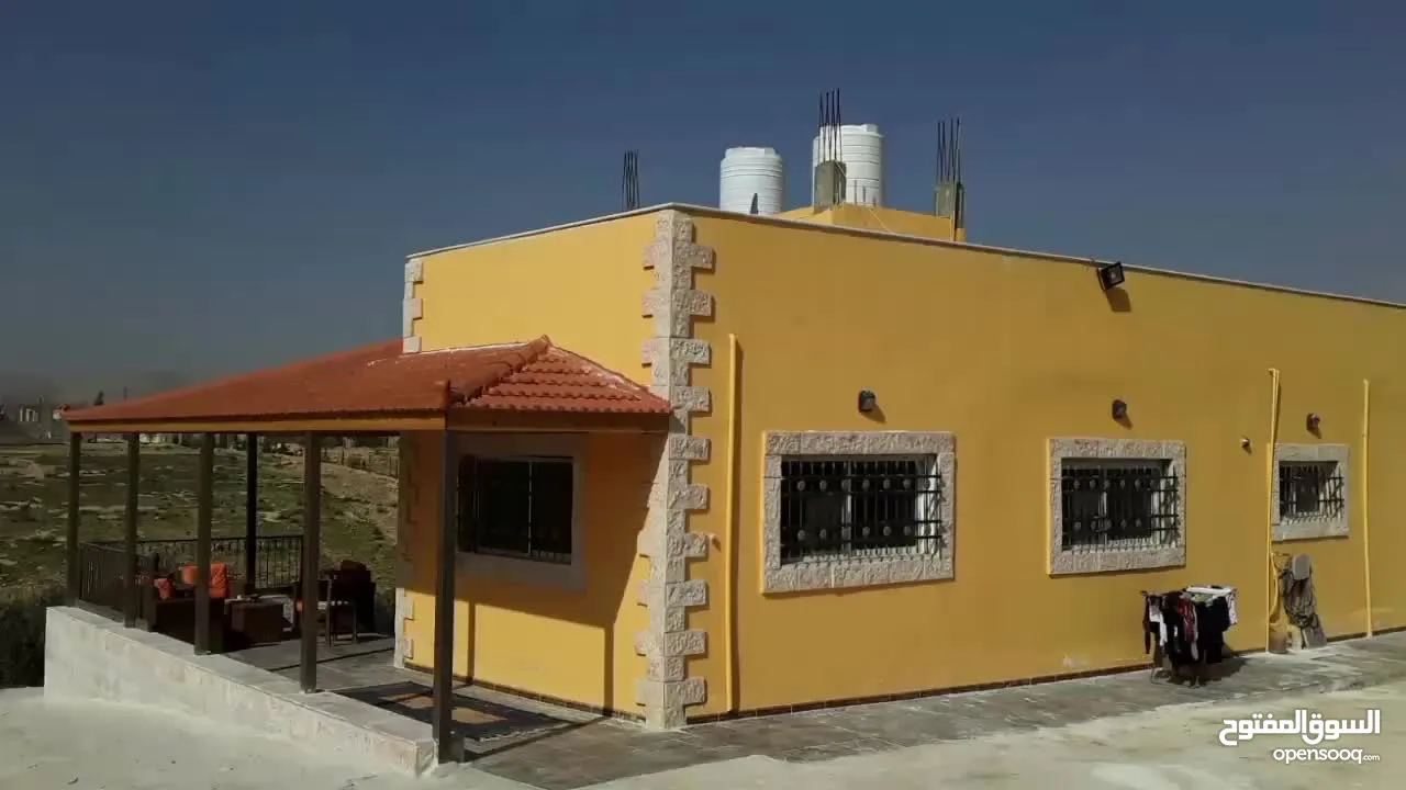 قطعة ارض مع بيت للبيع