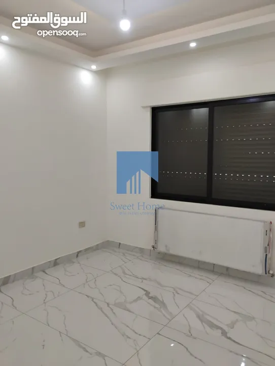 شقة أرضية فاخرة للبيع في الجاردنز  - خلف الدستور 155م مع ترس 25م تشطيب سوبر ديلوكس لم تسكن