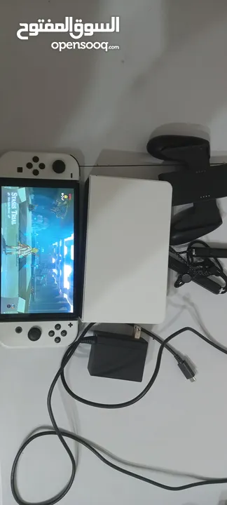 Nintendo switch oled معدله مع كامل اغراضها