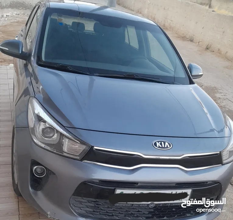 كيا ريو رمادي اصل شركة 2019  للبيع  ماشية 65 فقط