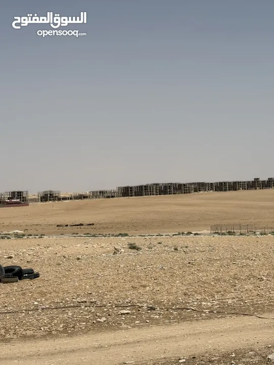 ارض في الجيزه على شارعين مقابل مجمع الدوائر