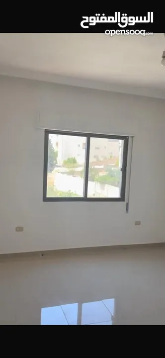 Excellent natural light and winds with views of Shafa Badran from the highest level in the building.