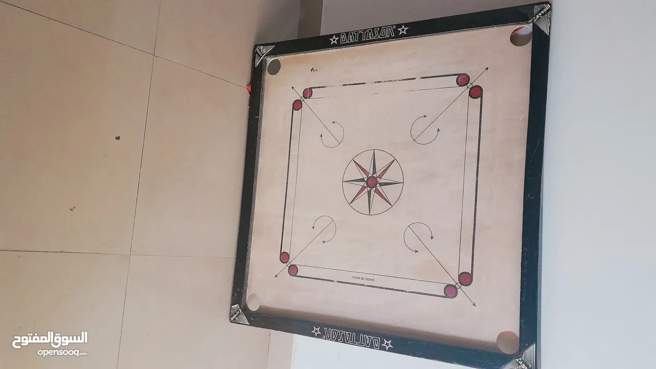 carrom board with 2 set of coins and powder box