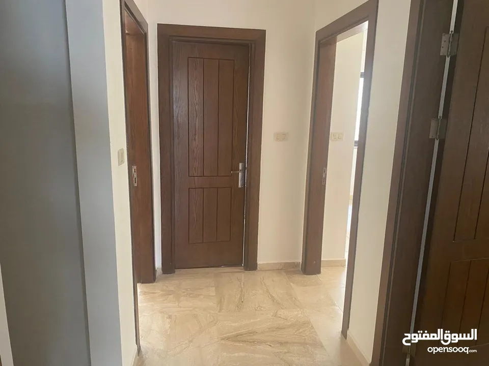 شقه فارغه ارضيه للايجار في دير غبار - REF : 14534