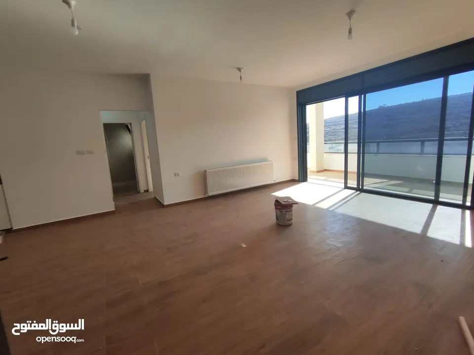 شقة قيد الفرش للإيجار – عين منجد / شارع إسكان المهندسين