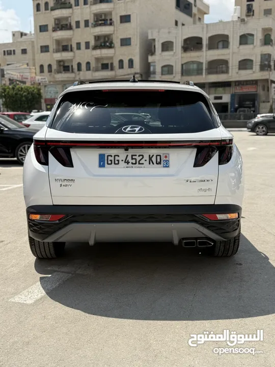 هونداي توسان ترخيص 2022 محرك 1600 هايبرد plug in/يقطع على الشحنه 52 كيلو متر
