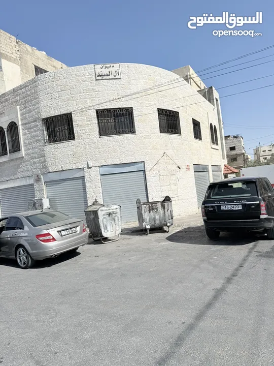 عمارة خلف الاستقلال مول بأول سوق النزهة الشعبي