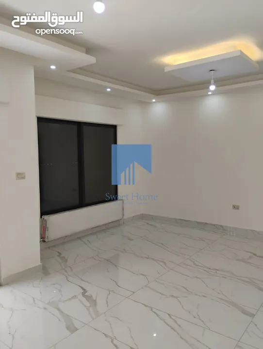 شقة أرضية فاخرة للبيع في الجاردنز  - خلف الدستور 155م مع ترس 25م تشطيب سوبر ديلوكس لم تسكن