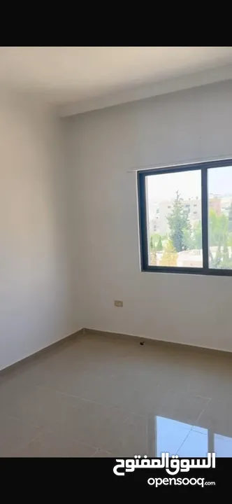 Excellent natural light and winds with views of Shafa Badran from the highest level in the building.