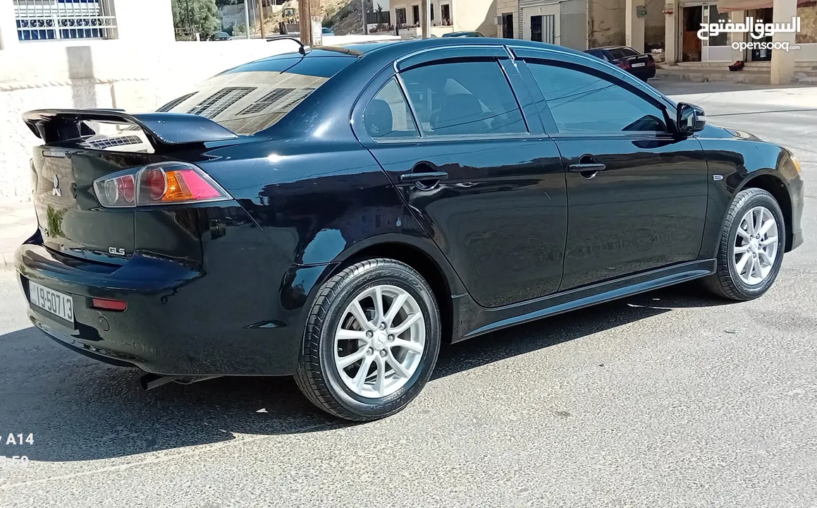 متسوبيشي لانسر فراشة موديل 2015 فحص مرفق مع الصور بحالة الوكاااااالة  ماشية 49 الف km  أصلي