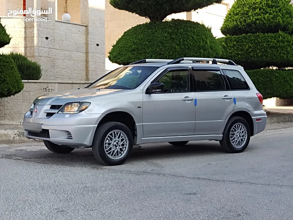 ميتسوبيشي آوتلاندر اوتوماتيك 2003 توب نظافة بسعرررر مميززز محرك 2400cc