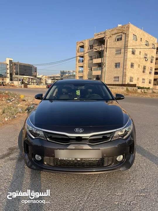 كيا K5 هايبرد موديل ال 2018 لون فيراني ميتالك  فحص اربعة جيد ولا ملاحظة فل كامل عدا الفتحة - كاش